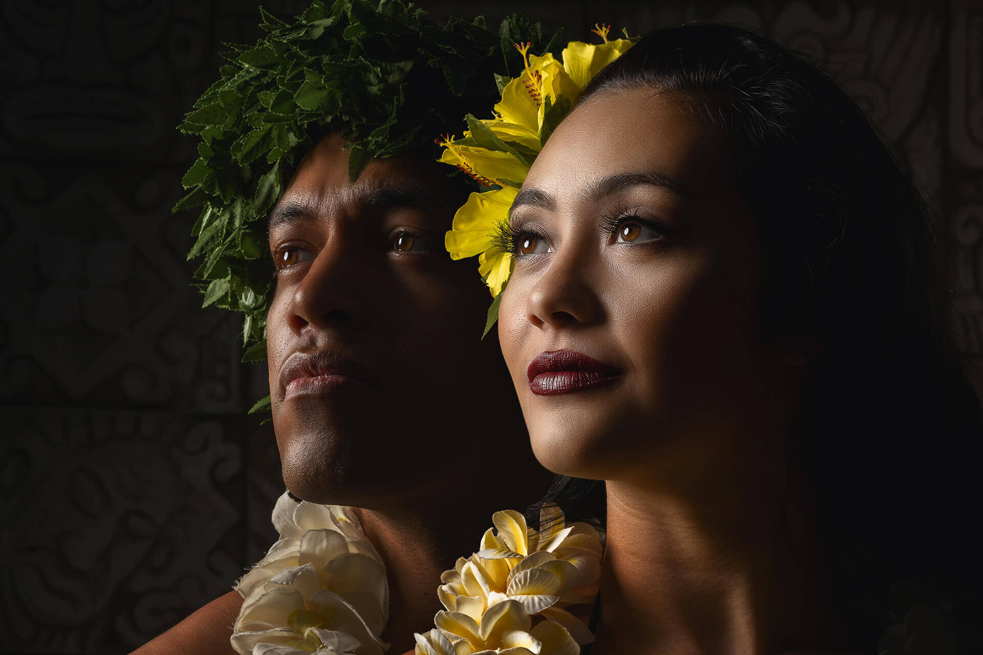 Chief Laiuni and Malia in a dramatic double portrait with floral details.